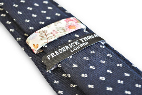 navy tie with white squared polka dot design