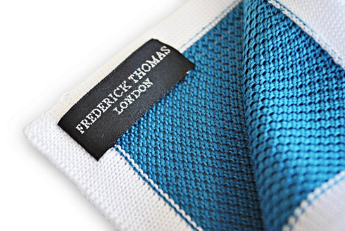 teal knitted pocket square with white edging
