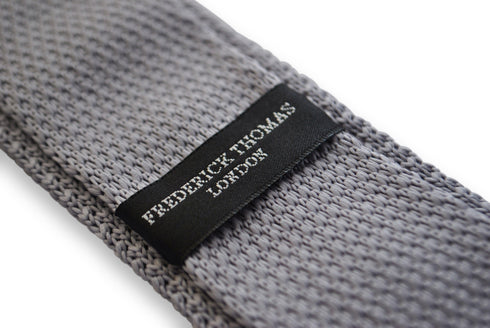 grey skinny knitted tie with pink polka dots