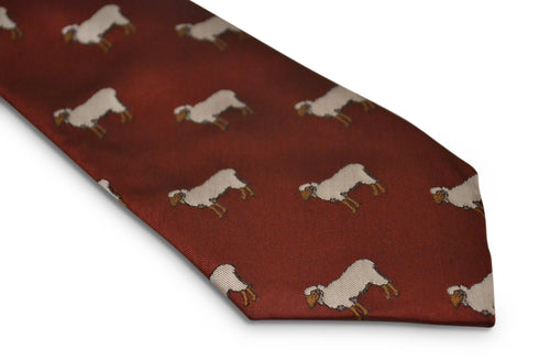 maroon tie with sheep embroidered design