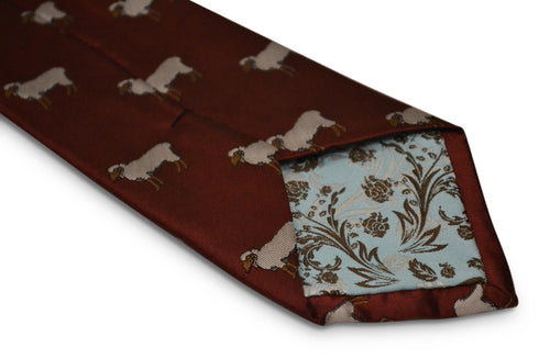 maroon tie with sheep embroidered design