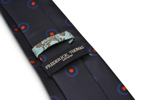 navy blue tie with red target print design