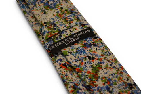 white with blue and green paint splatter design cotton tie