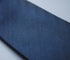 plain navy blue herringbone tie