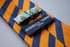 orange & navy blue striped tie