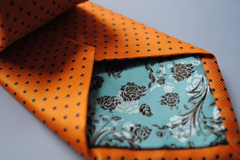 orange tie with black polka dots