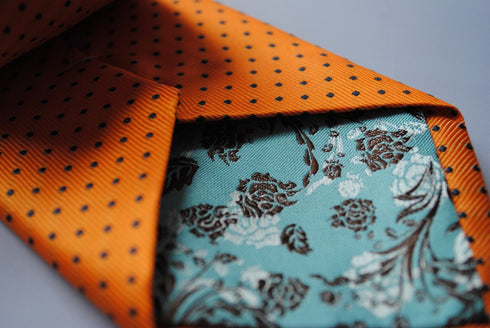 orange tie with black polka dots