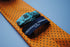 orange tie with black polka dots