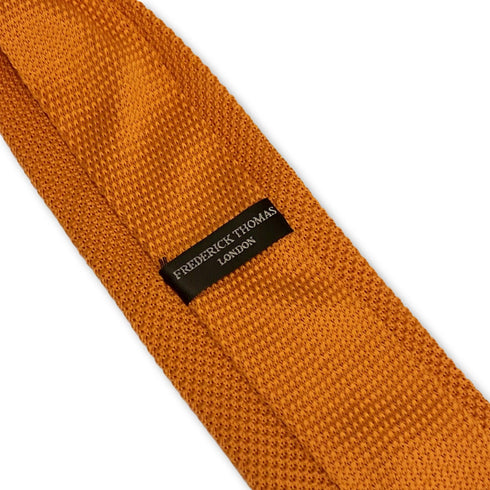 orange knitted tie with pointed end in standard 8cm width