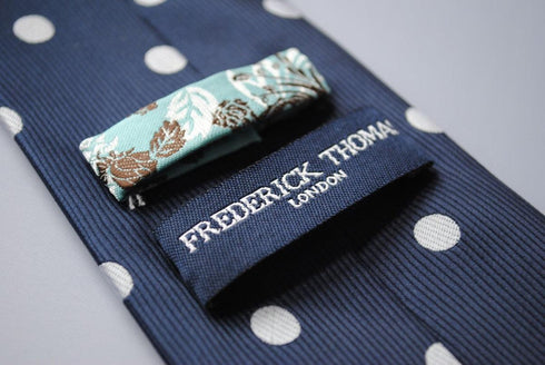 navy blue tie with white polka dots