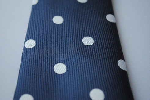 navy blue tie with white polka dots