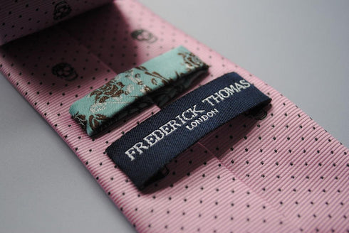 pink skulls design tie