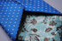 electric blue tie with white pin dots