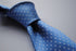 medium blue tie with white polka dots