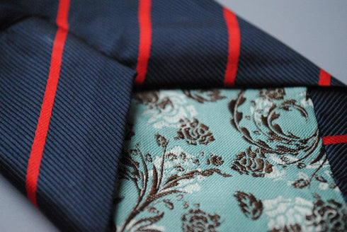 navy blue tie with thin red stripes