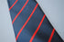navy blue tie with thin red stripes