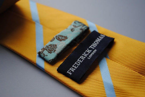 yellow tie with blue club stripe