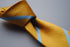 yellow tie with blue club stripe