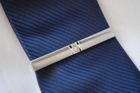 silver tie clip with jeweled pattern