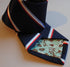 navy, red, white and light blue striped tie