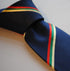 navy with green, yellow and red striped tie