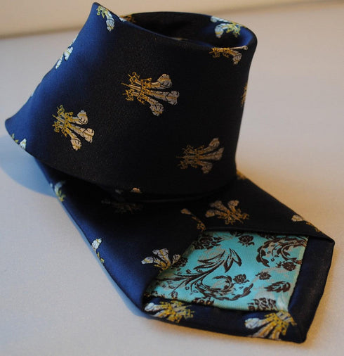 navy blue tie with prince of wales feathers badge print design