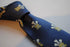 navy blue tie with prince of wales feathers badge print design
