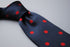 navy tie with red polka dots