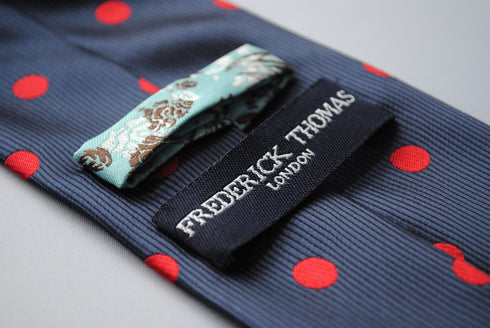 navy tie with red polka dots