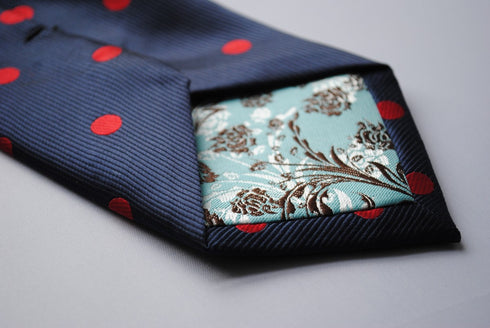 navy tie with red polka dots
