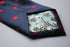 navy tie with red polka dots