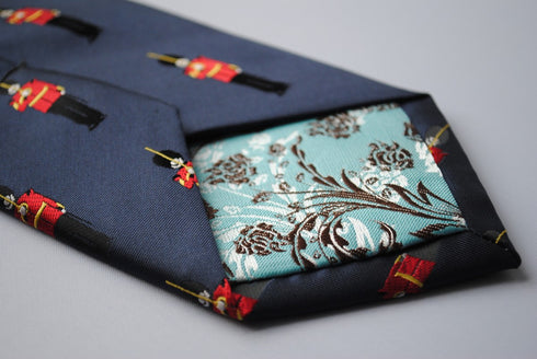 navy tie with royal queens guards pattern