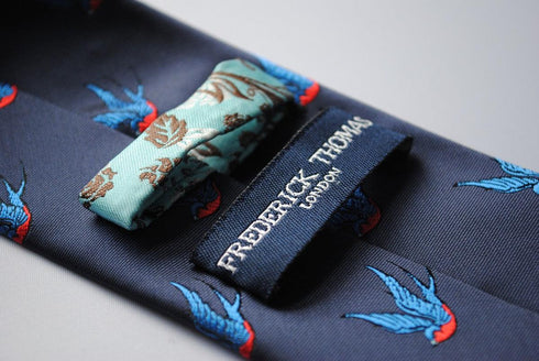 navy tie with swallow bird pattern