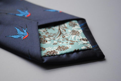 navy tie with swallow bird pattern