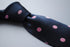 navy blue tie with pink polka dots