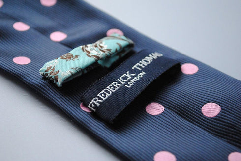 navy blue tie with pink polka dots