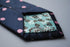 navy blue tie with pink polka dots