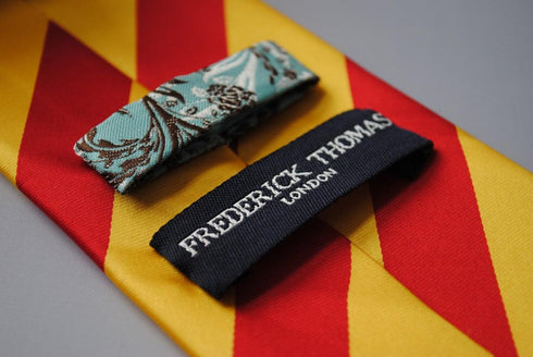 yellow and red barber striped tie