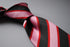 pink, red and black stripe tie