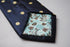 navy tie with yellow polka dots and signature floral reverse