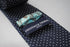 navy tie with small white polka dots