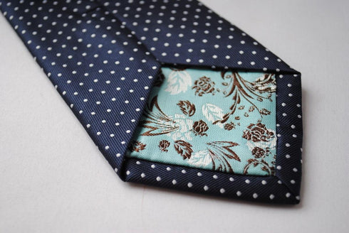 navy tie with small white polka dots