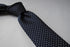 navy tie with small white polka dots