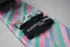 pink, white, blue and green striped tie
