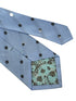 light blue tie with black polka dots