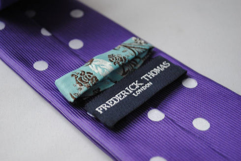 purple tie with white polka dots