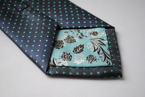 grey tie with turquoise pin spots