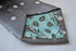 grey tie with white polka dots