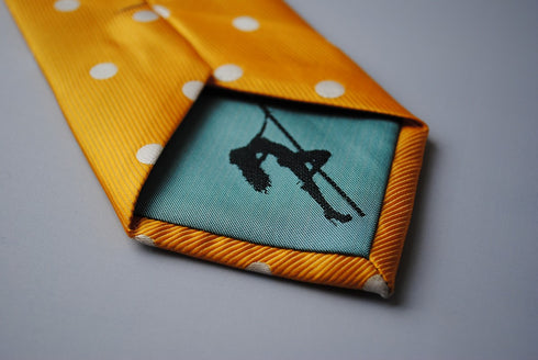 yellow tie with white polka dots