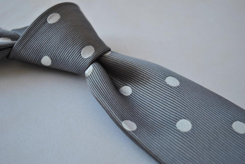 grey tie with white polka dots